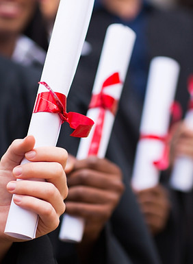 Graduates Holding Diplomas