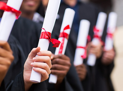 Graduates Holding Diplomas