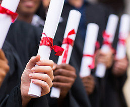 Graduates Holding Diplomas