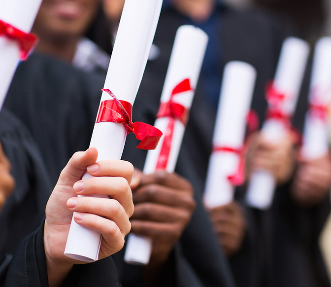 Graduates Holding Diplomas