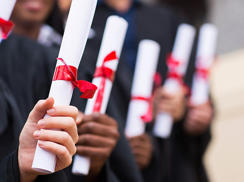 Graduates Holding Diplomas