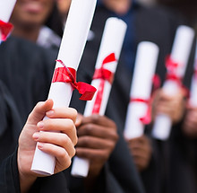 Graduates Holding Diplomas
