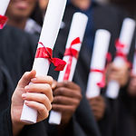 Graduates Holding Diplomas
