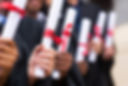 Graduates Holding Diplomas