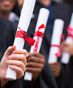 Graduates Holding Diplomas