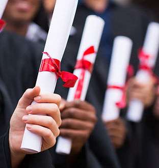Graduates Holding Diplomas