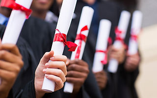 Graduates Holding Diplomas