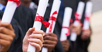 Graduates Holding Diplomas