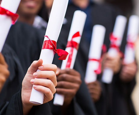 Graduates Holding Diplomas