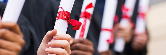 Graduates Holding Diplomas