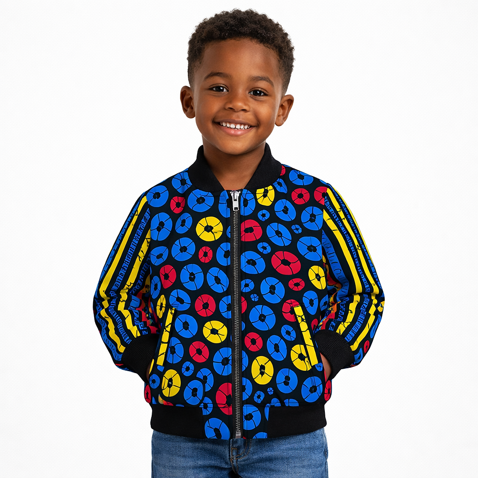 Young boy smiles, wearing Kids Abstract Print Bomber Jacket, colorful circles.