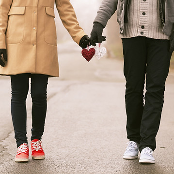 Couple Holding Hearts