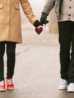 Couple Holding Hearts