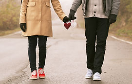 Couple Holding Hearts