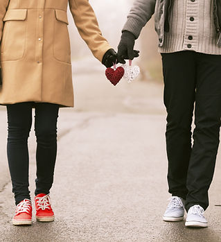 Couple Holding Hearts