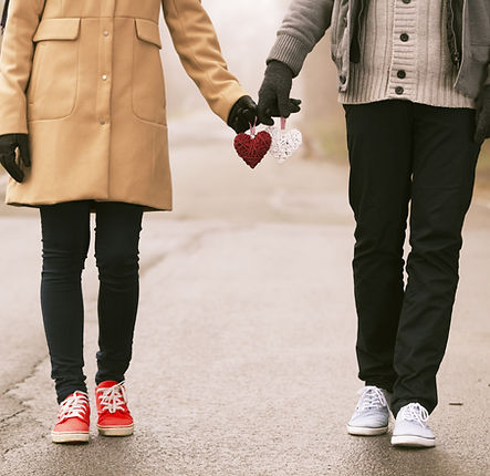 Couple Holding Hearts