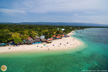 Marvel at this vibrant aerial view of the Moalboal coast. Book your Moalboal marine and reef tour to explore these tropical waters with Pearl Horizon Travel.