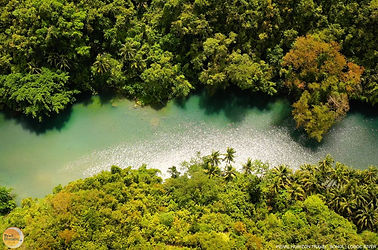 An aerial perspective of the lush green Loboc River in the Philippines. Secure your Bohol countryside private tour package easily with Pearl Horizon Travel.