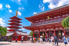 Tokyo Sensoji Temple main hall and five-story pagoda under a bright blue sky, historic Asakusa heritage site