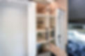 custom camper van interior with floor-to-ceiling closet, adjustable shelves