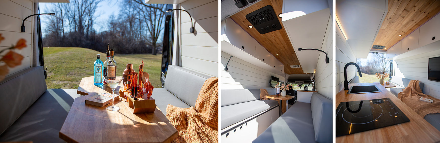 A detailed view of the camper van's dinette area, featuring stylish grey faux leather seats, upper cabinets on both sides for storage, and a wall-mounted TV for entertainment. The space is designed for both comfort and functionality. The kitchen is in the front of the dinette area with a sink and an induction cooktop
