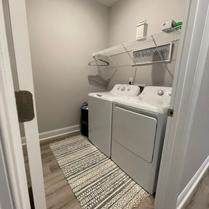Spacious laundry room includes brand new GE washer and dryer appliances for our guest's needs. Laundry pods and un/scented dryer sheets are provided. Also includes one tabletop ironing board, one full size ironing board, and iron hanging behind door.