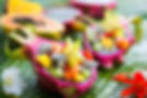 Exotic fruit salad served in half a drag