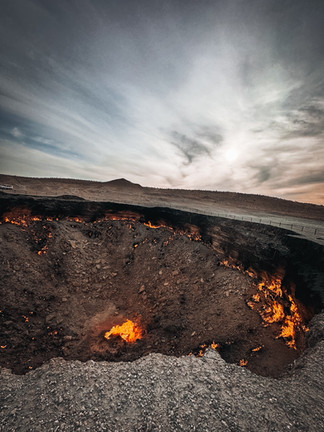 Flaming Darvaza Gas Crater glowing under a starry night sky in Turkmenistan