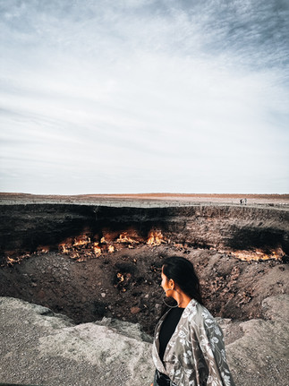 Flaming Darvaza Gas Crater glowing under a starry night sky in Turkmenistan