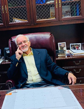 Mayor of Warrior, Alabama seated at his office desk, smiling.