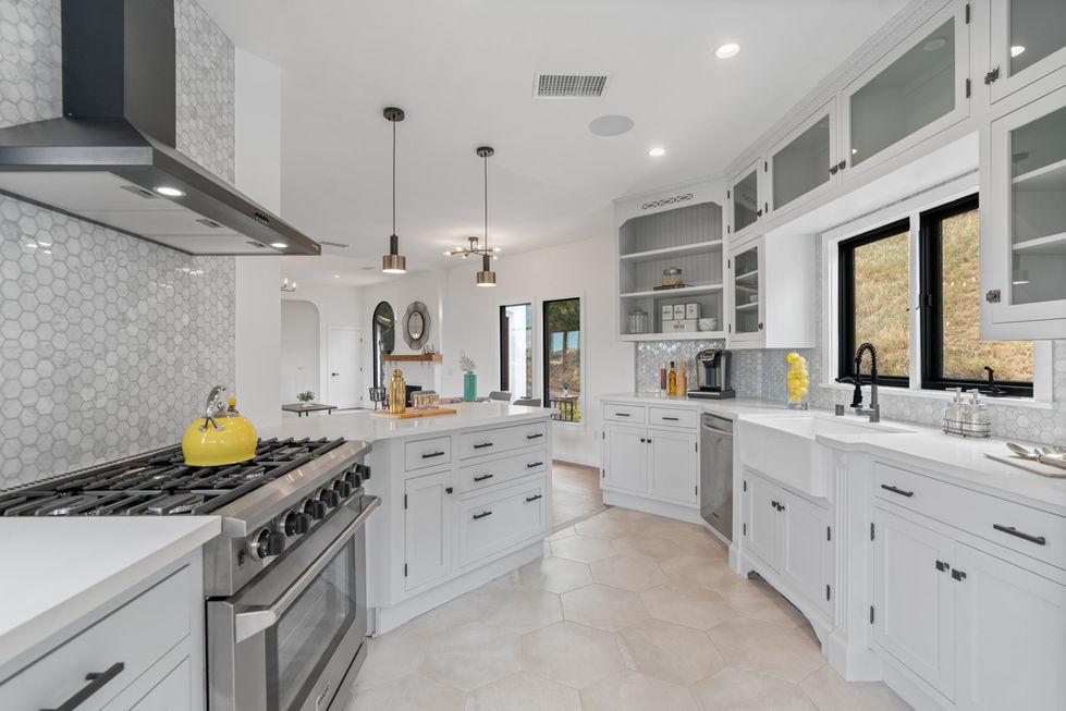 a kitchen with stainless steel appliances and white cabinets