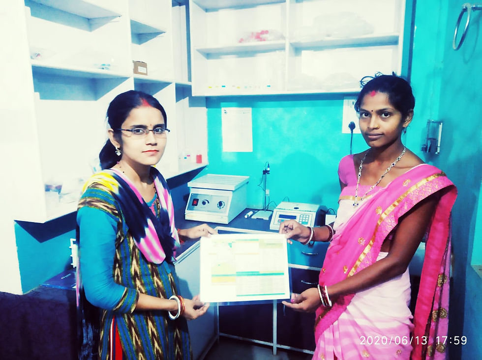 Ms Veena giving Soil Health Card to a women farmer with Harvesto Soil Testing Lab