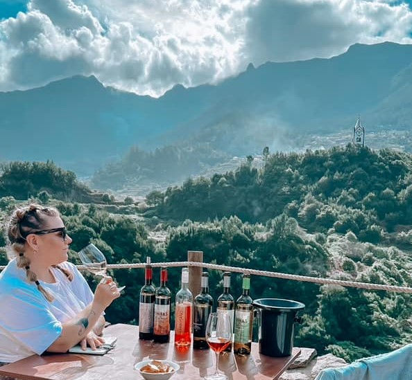 Jessi's Journey drinking wine in Albania