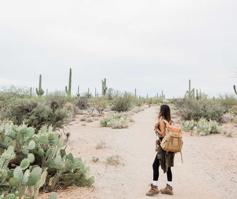 Woman hiking through desert