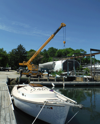 hydraulic boat crane and sailboat