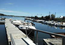 marina docks with boats in slips and moorings