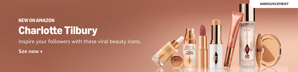 Charlotte Tilbury beauty products on brown background. Includes lipstick, spray, serum, compact. Text: New on Amazon. See now.