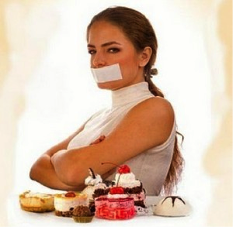 Another typical image of “women dieting” which shows a Caucasian woman with her hair pulled back in a sleeveless white shirt. An array of desserts (cakes, custards, pies, with whipped cream and glistening red cherries) lay in front of her on a table. She is turned slightly away from them, her arms are crossed in resolve and, in the event her resolve fails, her mouth is covered with a wide strip of white tape. This is typical of a sort of image which I think of as “woman denying food pleasure.” This notion is strongly associated with dieting generally: denial and self-control. 