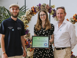DEFRA Bee's Needs Award ceremony with people collecting award plaque