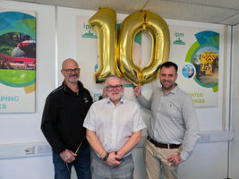 Neil, John and Jay with '10' balloons celebrating a decade with IPM