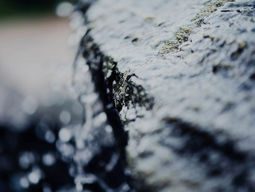 Flowing water representing sustainable water management and efficiency
