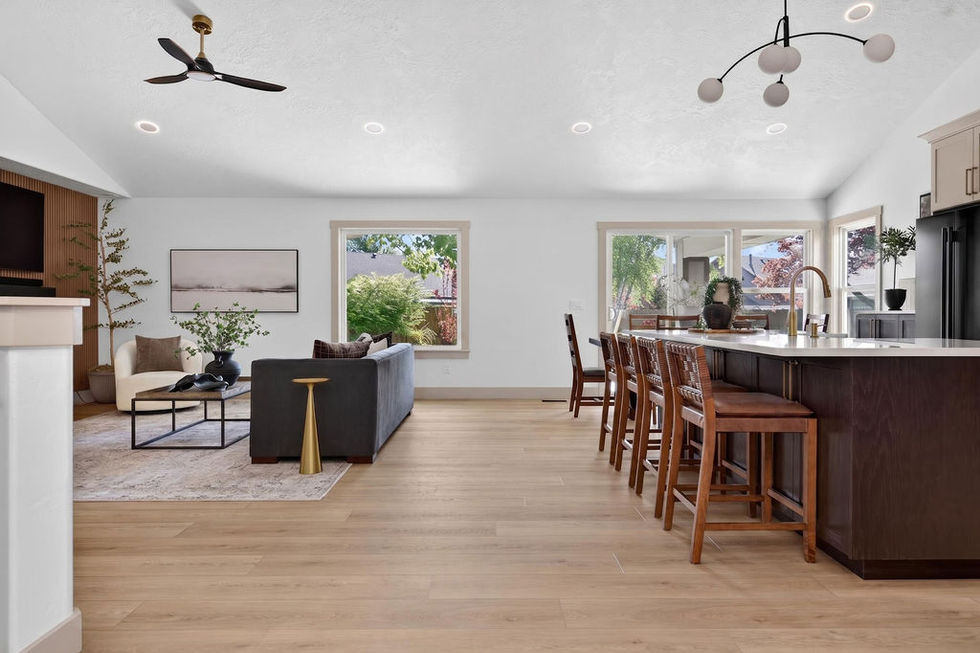 Spacious modern living and dining area with wooden flooring.
