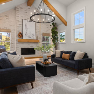 a living room with a map of idaho above the fireplace