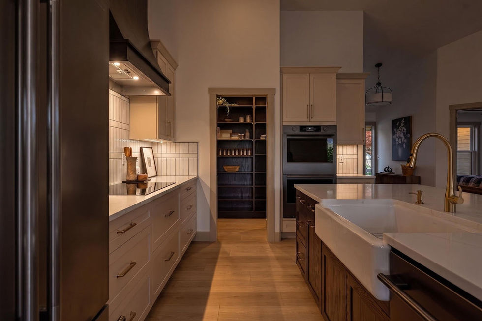 Modern kitchen with sleek design and warm lighting.