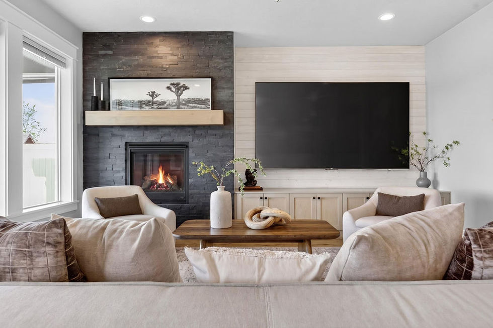 Modern living room with fireplace and large TV.