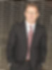 Smiling man in suit and glasses