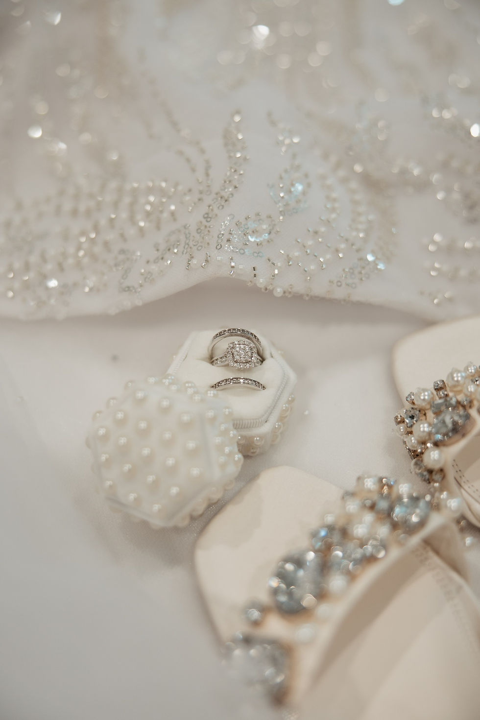 bride's wedding rings and wedding shoes