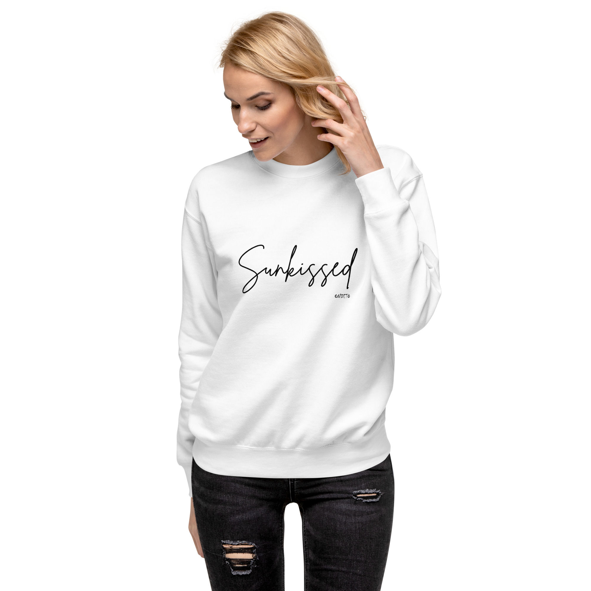 Blond woman wearing a Sunkissed white premium crewneck sweater