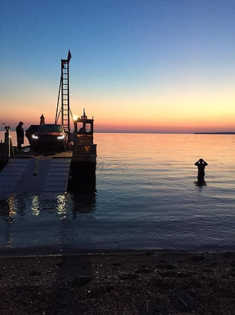 Jim "The Shark" Dreyer about to start swim to Mackinac Island, towing barge with car.