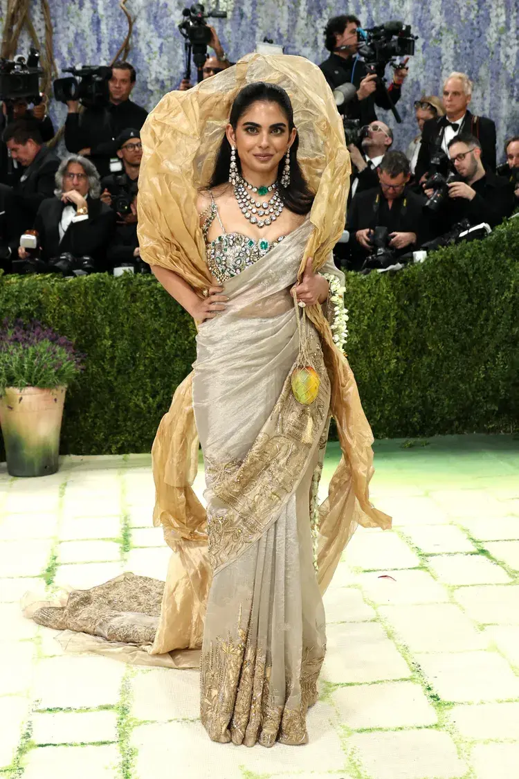 Isha Ambani at Met Gala 2026 wearing custom Gaurav Gupta gold sari with 1800-carat diamond blouse and Nizam sarpech from Nita Ambani's collection